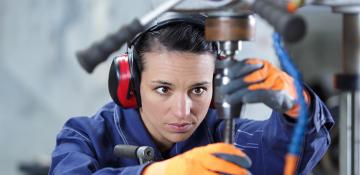 Woman using machinery